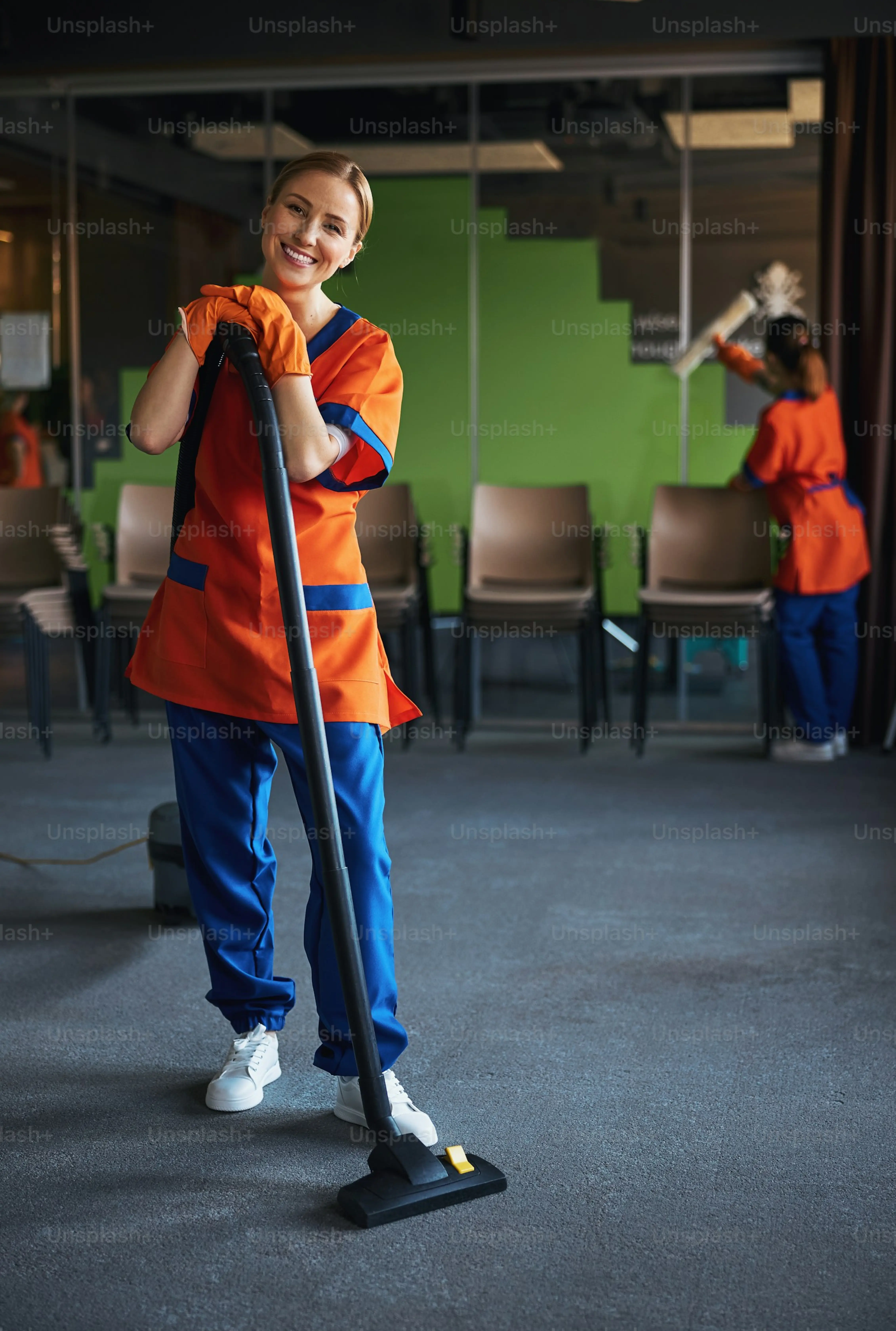 Cleaning professionals wearing masks and gloves